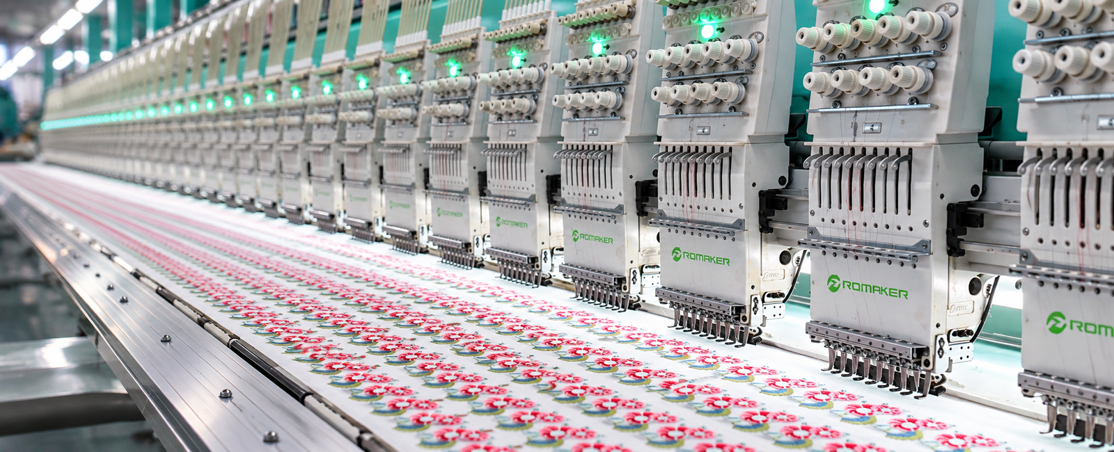 The LOVECOLOUR factory in Baiyun District, Guangzhou, with embroidery bays and finished custom patches on the production floor.