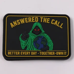 Black rectangular tactical PVC patch with green hooded figure and globe