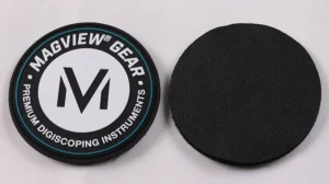 Front and black hook-and-loop backing of a round custom PVC patch
