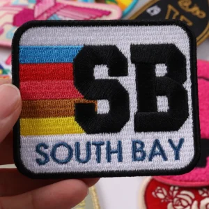 Rectangular South Bay embroidered patch with SB lettering and colorful stripes
