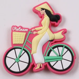 Pink Vietnam souvenir PVC tag with woman in traditional dress riding a bicycle