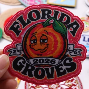 Red Florida Groves 2026 embroidered patch with smiling orange mascot