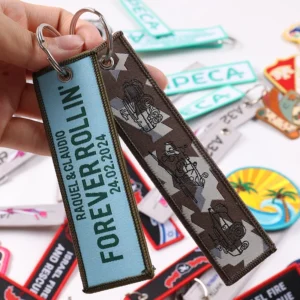 Blue For Every Run tag and brown motorcycle illustrated key tag with metal rings