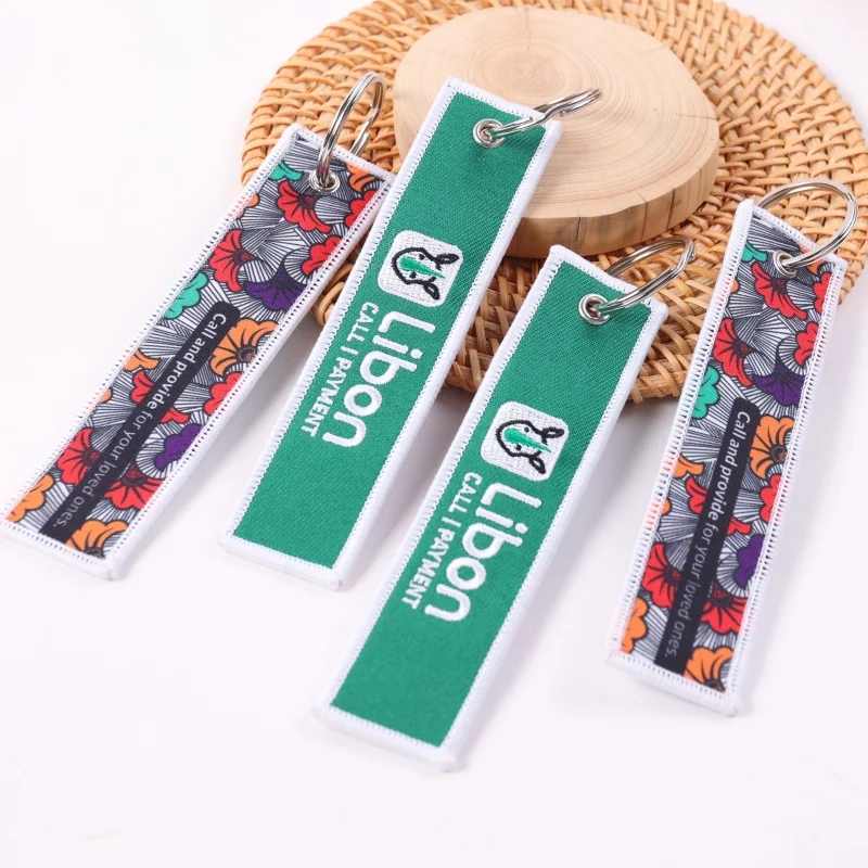 Green and patterned fabric keychain straps with silver metal split rings
