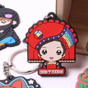 Red-hatted cartoon character soft PVC keychain with a silver split ring.