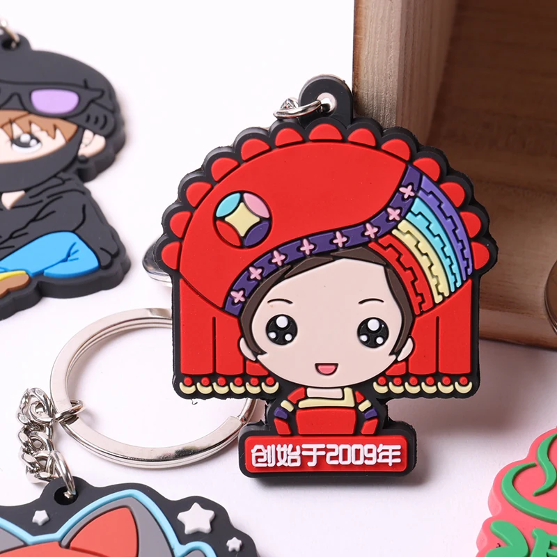Red-hatted cartoon character soft PVC keychain with a silver split ring.