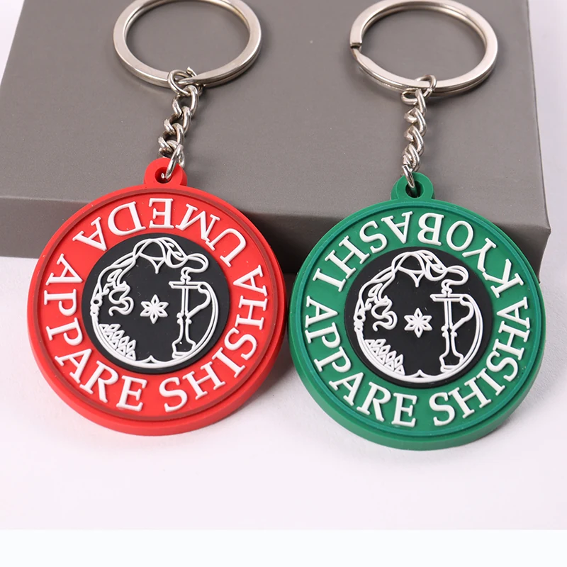 Red and green round Compare Apparel PVC keychains with silver key rings
