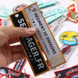 Black Sela Haggerty and tan Parfums de Demons fabric keychains