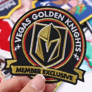 Circular Vegas Golden Knights embroidered patch with gold knight helmet motif