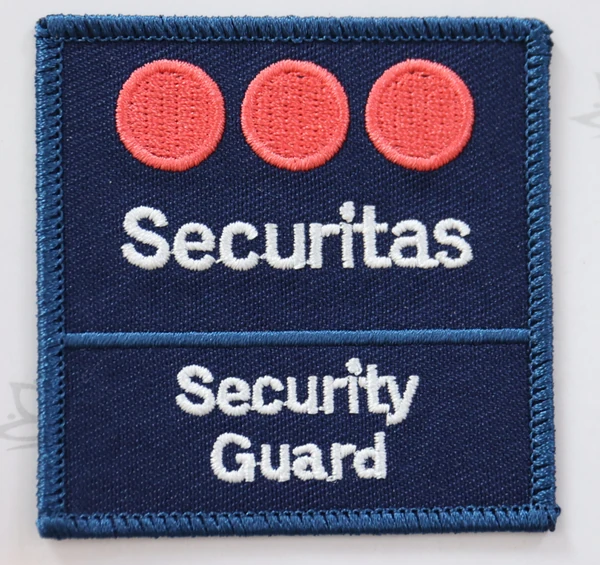 Navy rectangular patch with three red circles, white Securitas lettering and a separate Security Guard text section below.